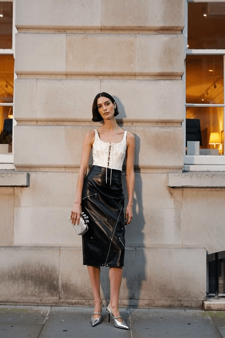 AI styling visual of a fictional adult woman wearing the Alexander McQueen evening outfit; exact pieces appear in the retailer photographs.